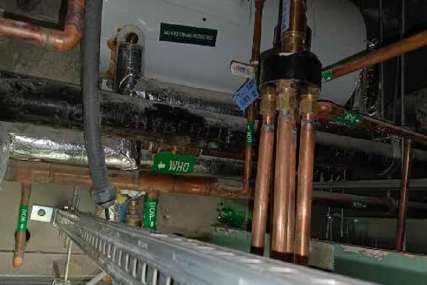 Insulated chilled water pipework in a plant room